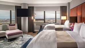 A hotel room with a large bed, a sofa, a desk, and a TV. There are large windows with a city view. - The Westin Copley Place, Boston, a Marriott Hotel (Boston)