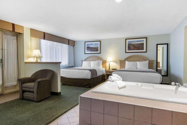 Jacuzzi Suite, Two Queen Beds | Premium bedding, desk, iron/ironing board, free WiFi - Flamingo Hotel (Medicine Hat)