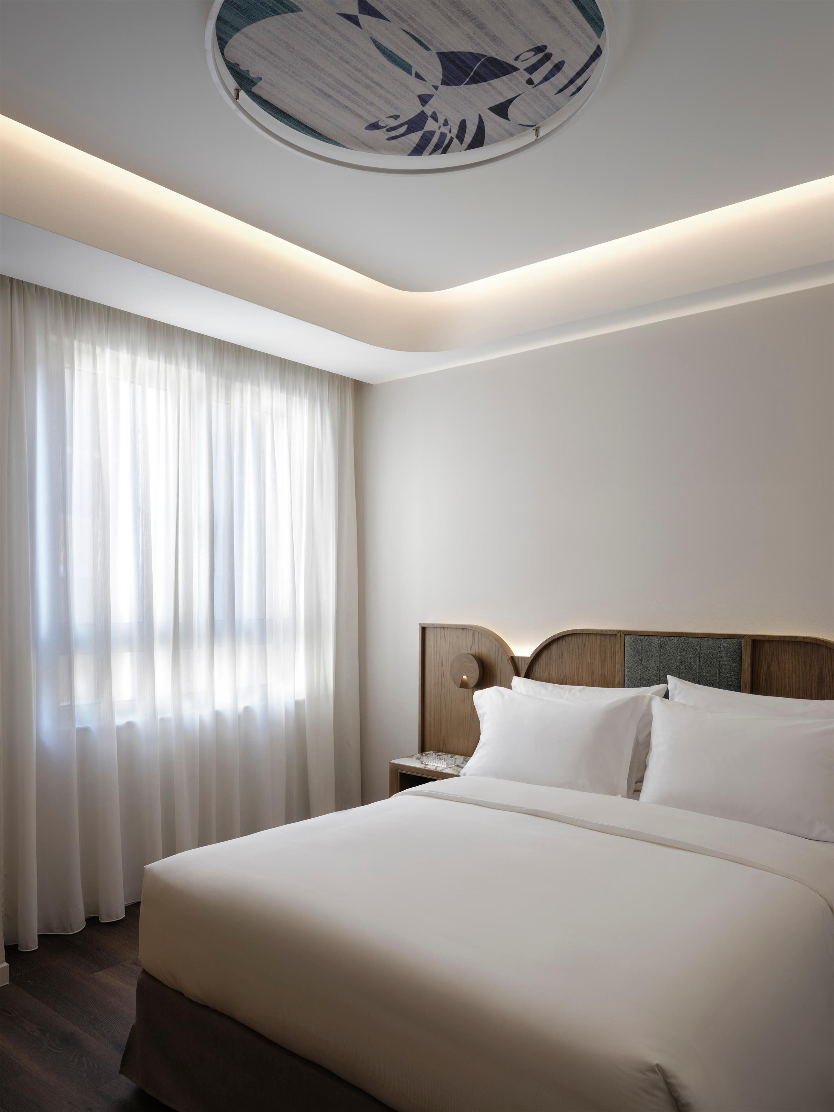 Slow | Premium bedding, down comforters, Select Comfort beds, minibar