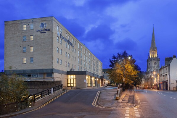 Experience the welcoming facade of DoubleTree by Hilton, featuring a prominent corner location and adjacent pedestrian access.