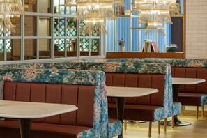 Enjoy a classic dining experience in our cozy booths and stylish tables.
