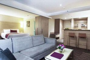 Executive Suite, 1 King Bed, Balcony | In-room safe, desk, blackout drapes, iron/ironing board