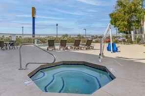 Outdoor pool, open 7:00 AM to 11:00 PM, pool umbrellas, sun loungers