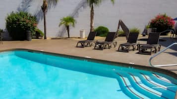 Outdoor pool, open 7:00 AM to 11:00 PM, pool umbrellas, pool loungers