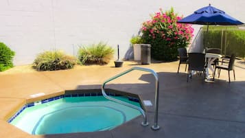 Outdoor pool, open 7:00 AM to 11:00 PM, pool umbrellas, pool loungers