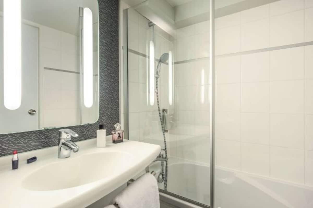 Bathroom | Shower, eco-friendly toiletries, hair dryer, towels