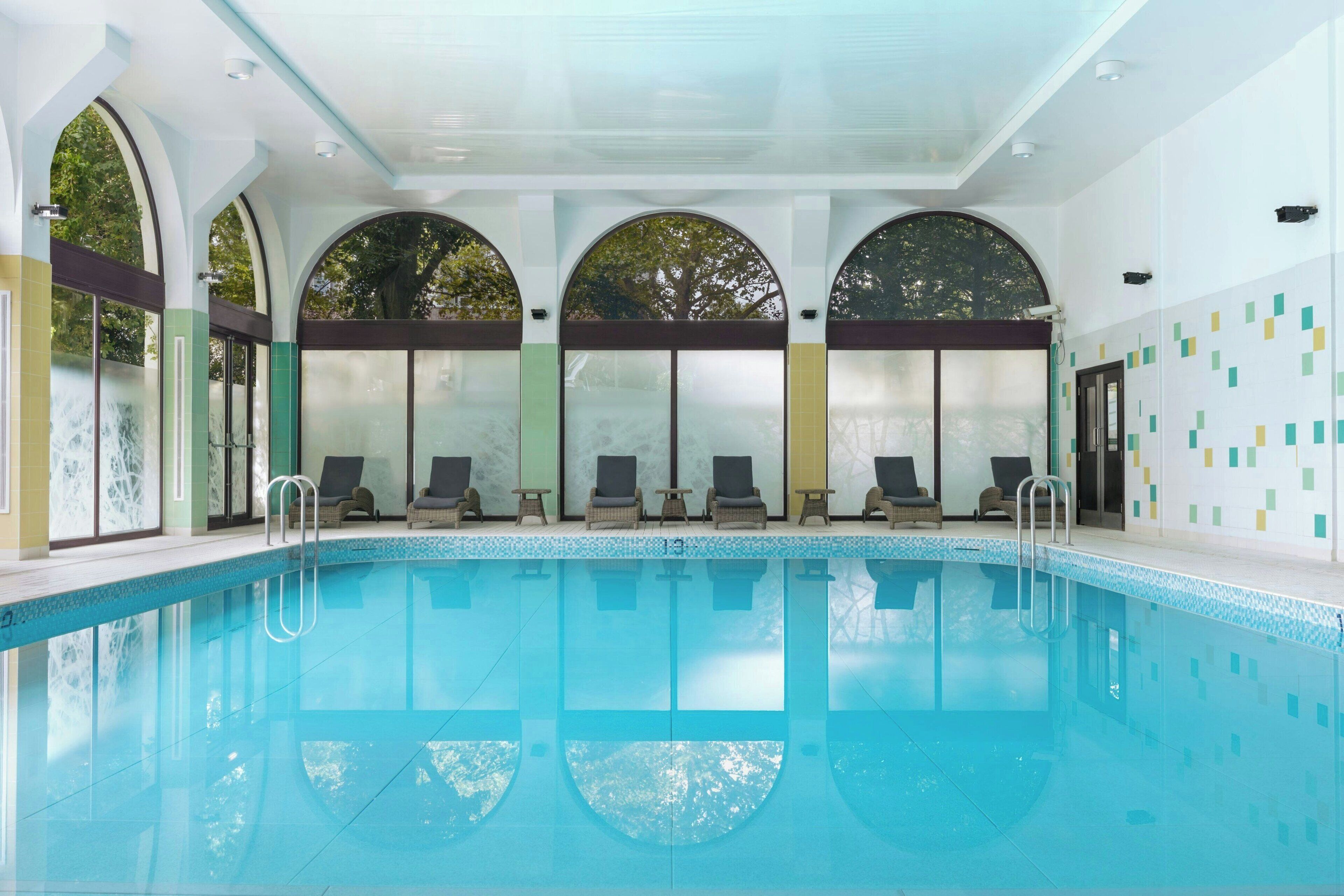 Indoor pool, open 6:00 AM to 11:00 PM, pool loungers