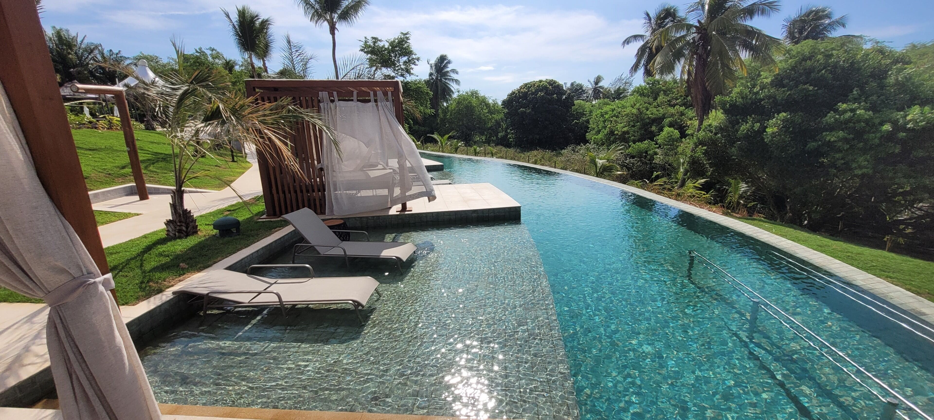 outdoor pool, pool umbrellas, pool loungers