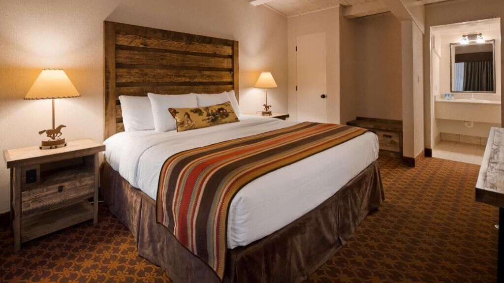 Hypo-allergenic bedding, desk, laptop workspace, blackout curtains