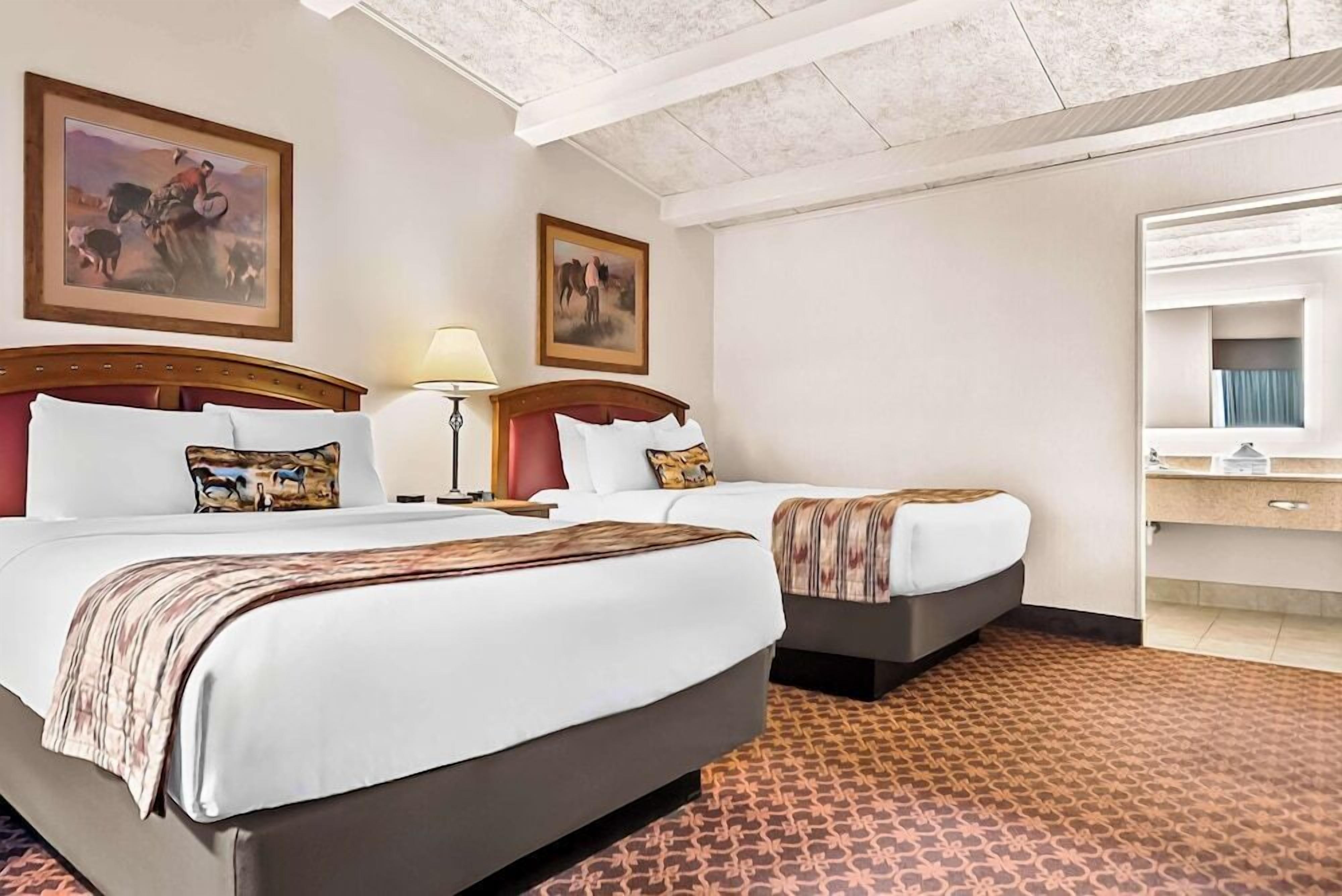 Hypo-allergenic bedding, desk, laptop workspace, blackout curtains
