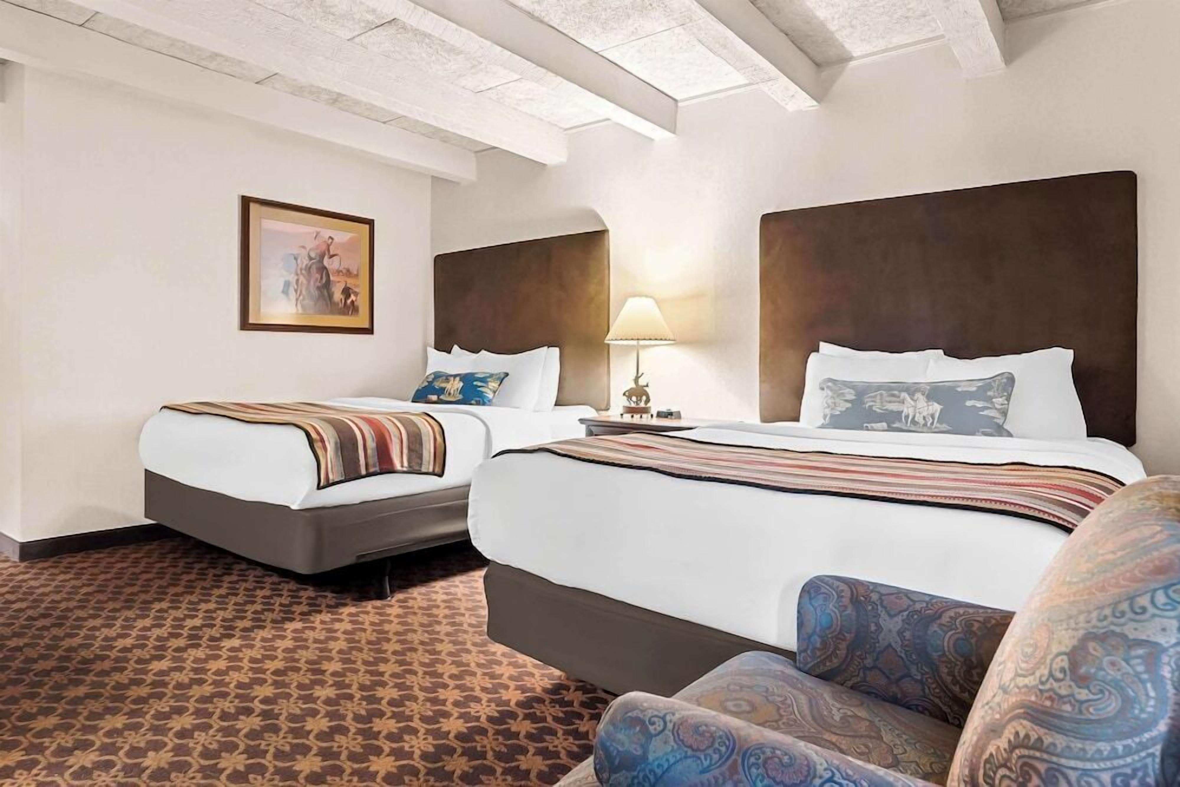 Hypo-allergenic bedding, desk, laptop workspace, blackout curtains