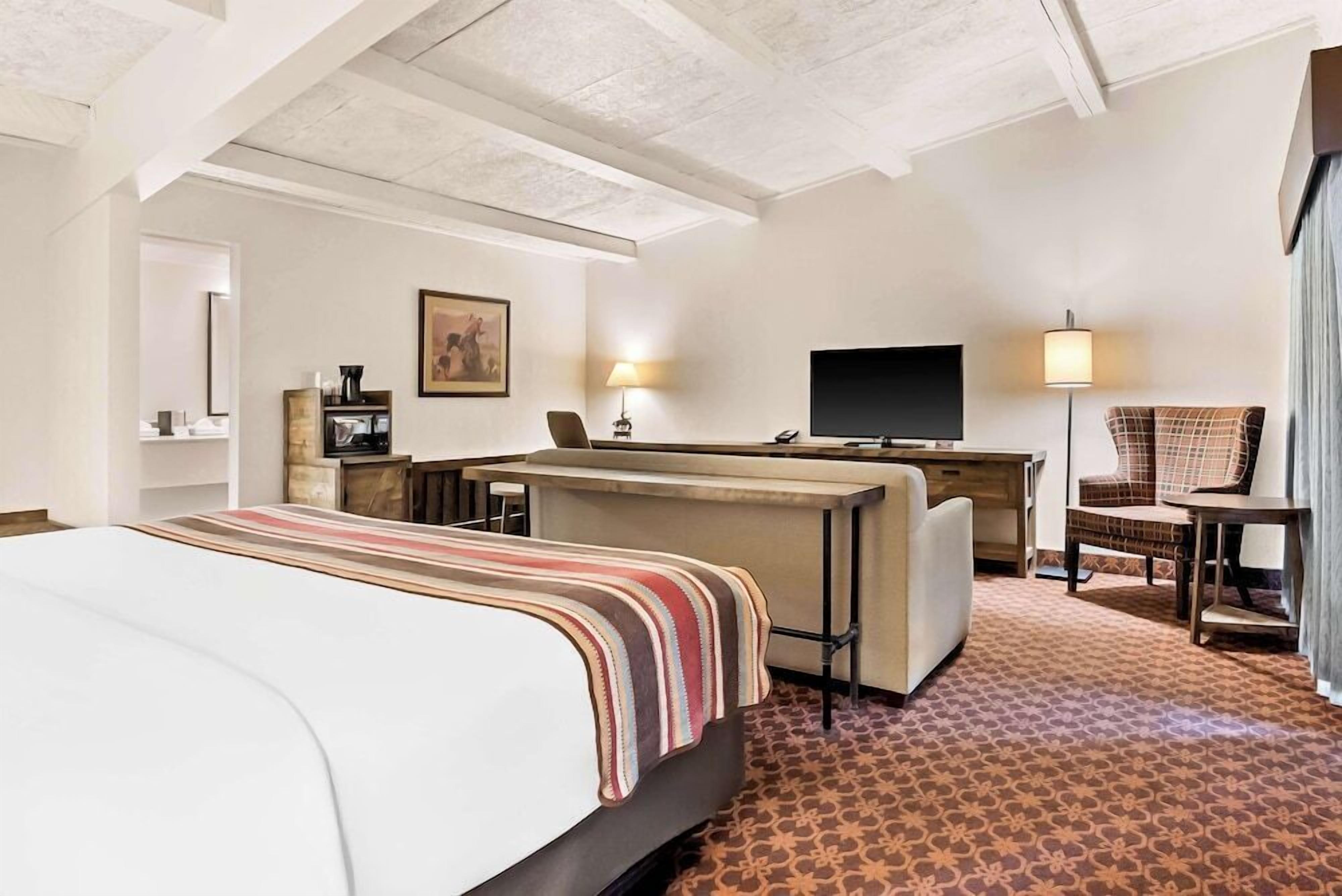 Hypo-allergenic bedding, desk, laptop workspace, blackout curtains