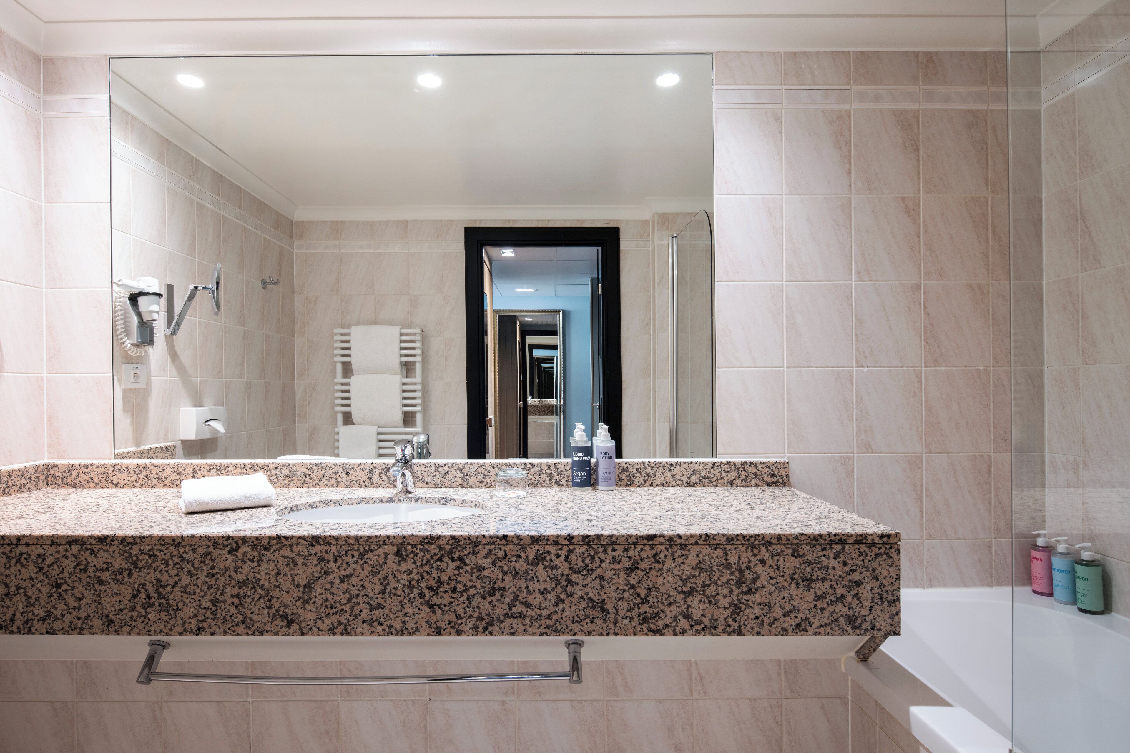 eco-friendly toiletries, hair dryer, towels