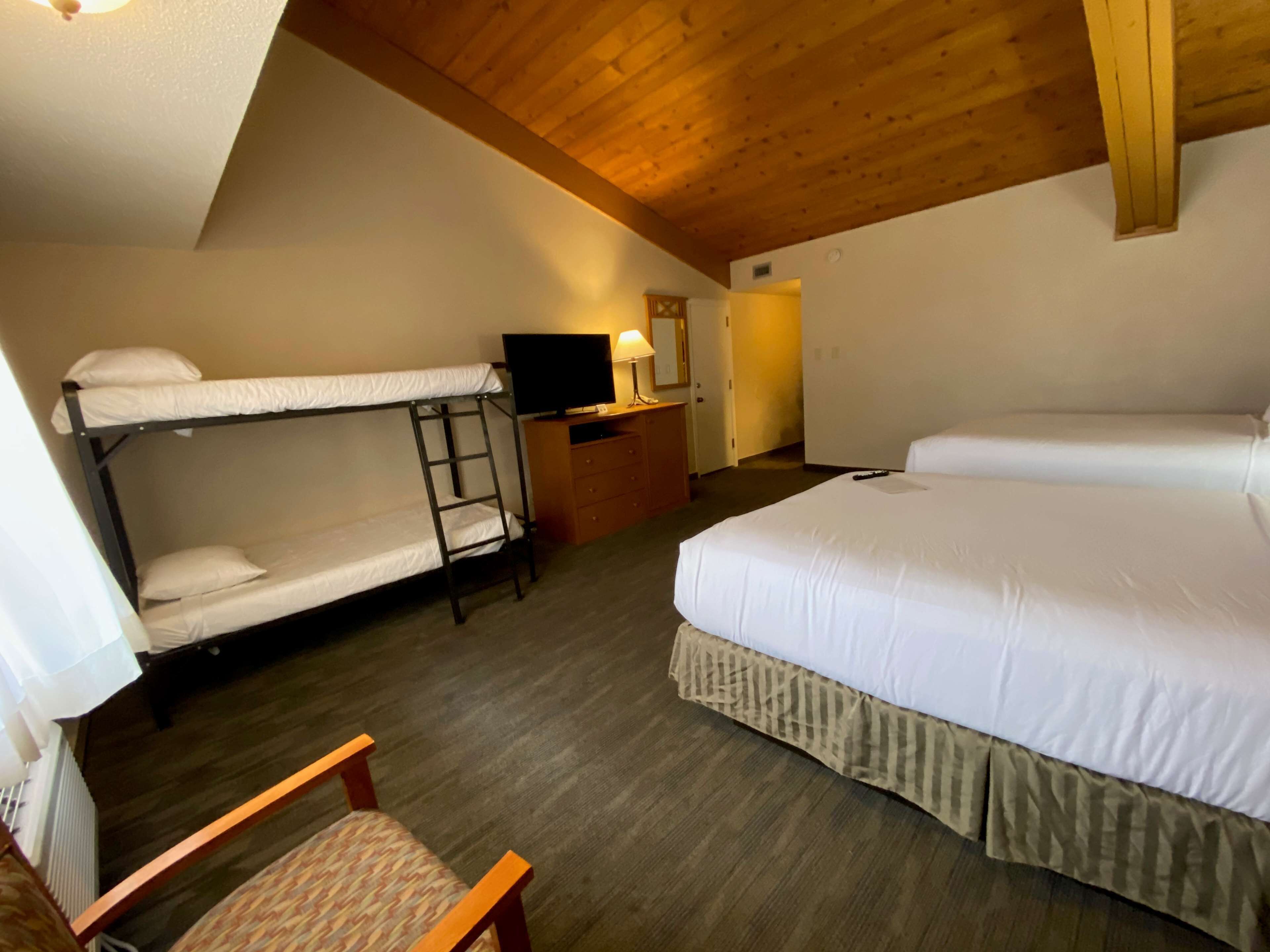 family room, 2 queen beds, non smoking, refrigerator (bunk beds) | blackout curtains, iron/ironing board, free cots/infant beds