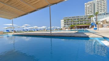 Indoor pool, outdoor pool, pool umbrellas