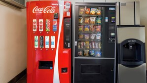 A vending machine with a Coca-Cola logo and a snack vending machine next to it. - Red Roof Inn Wilkes-Barre Arena (Wilkes-Barre)