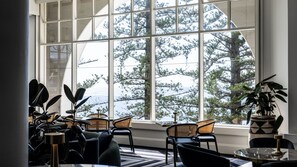 A room with a large window, multiple chairs, and a table. - Crowne Plaza Terrigal Pacific by IHG (Terrigal)