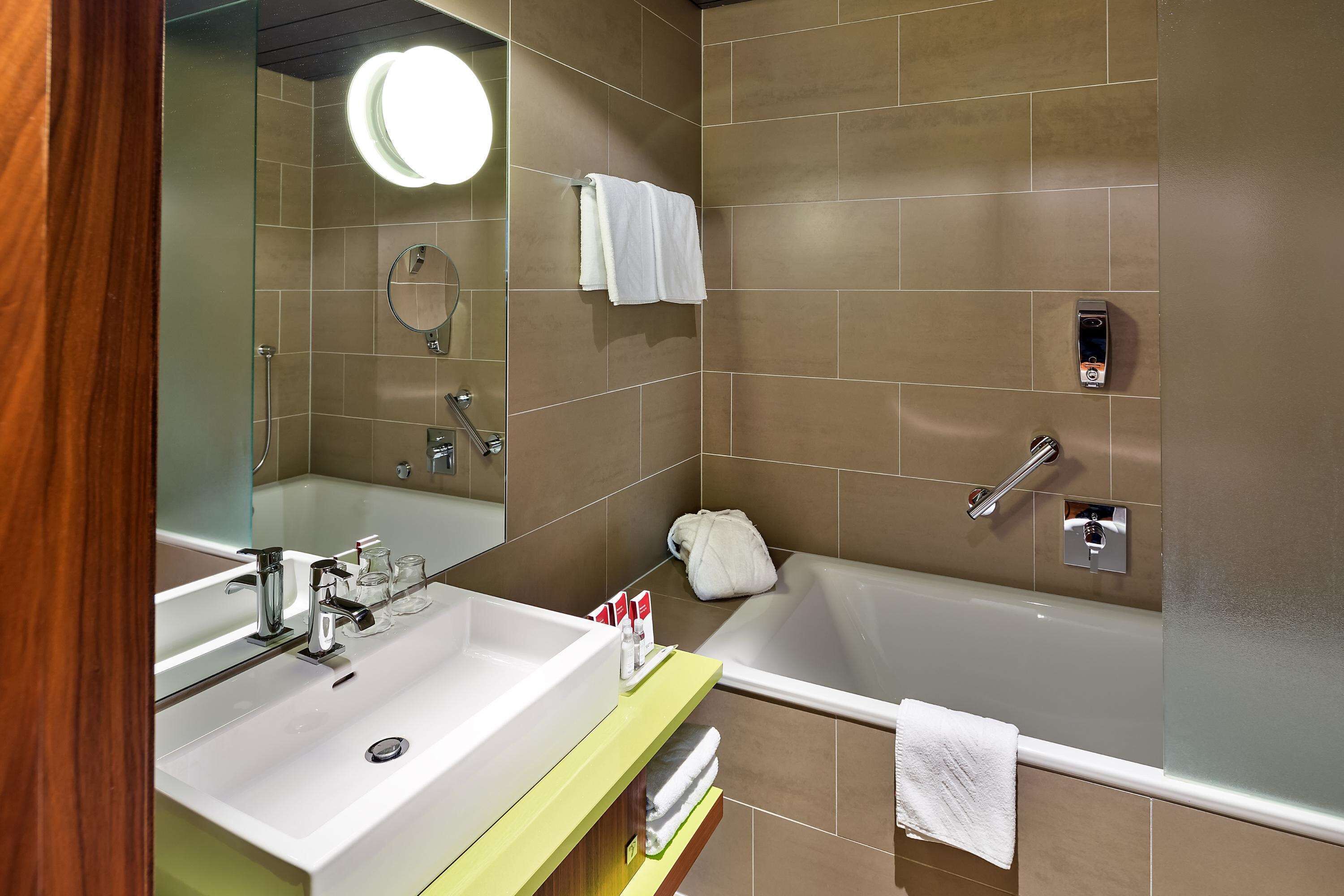 premium room | bathroom | hair dryer, towels, soap, shampoo