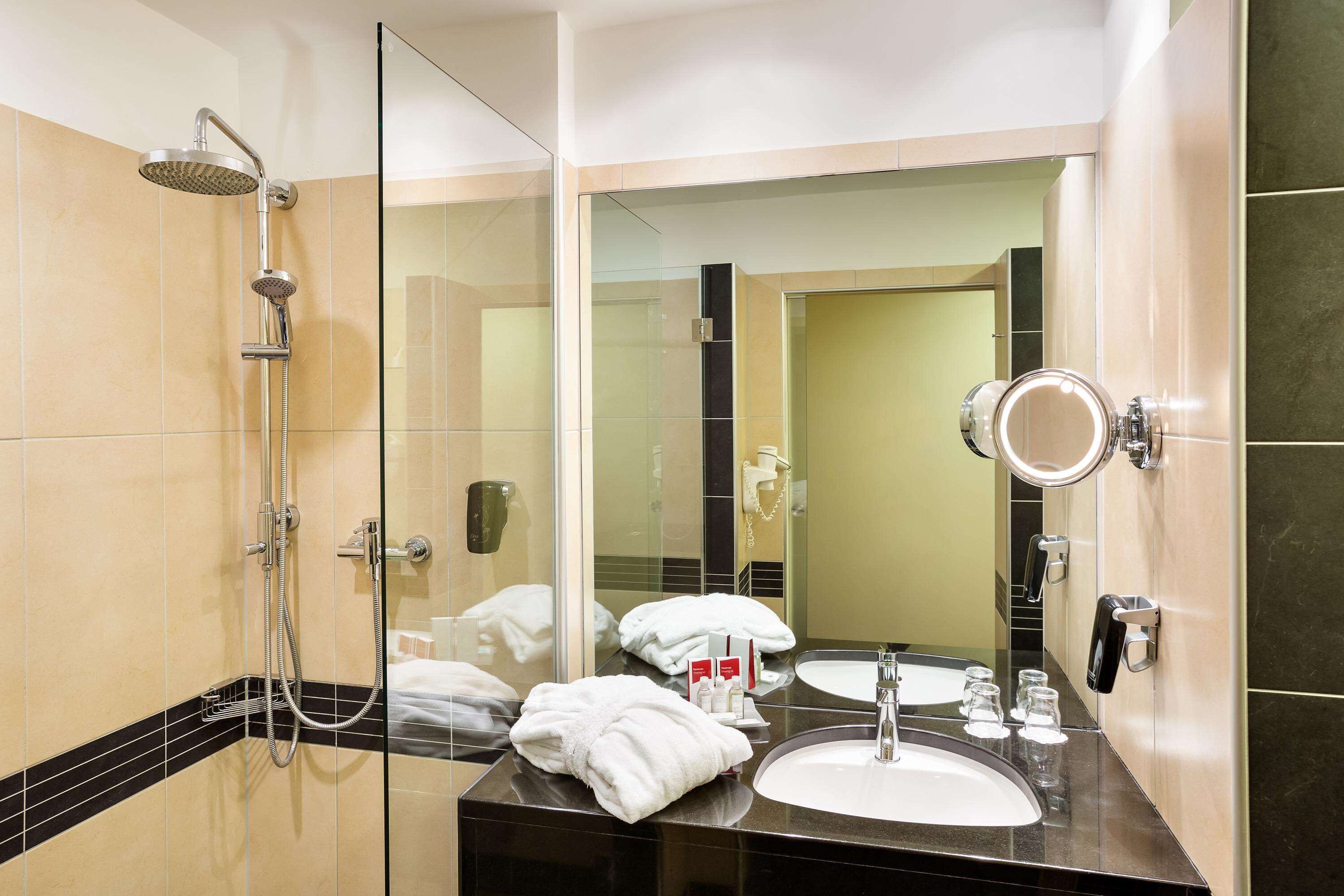 premium room | bathroom | hair dryer, towels, soap, shampoo