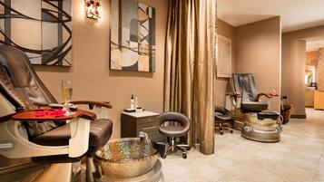 Relax in a serene spa room with a reclining chair, footrest, and massage chair.