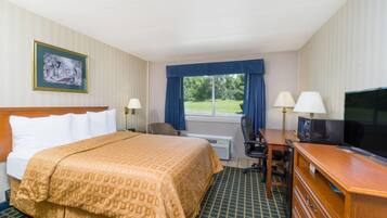 Desk, laptop workspace, blackout drapes, iron/ironing board