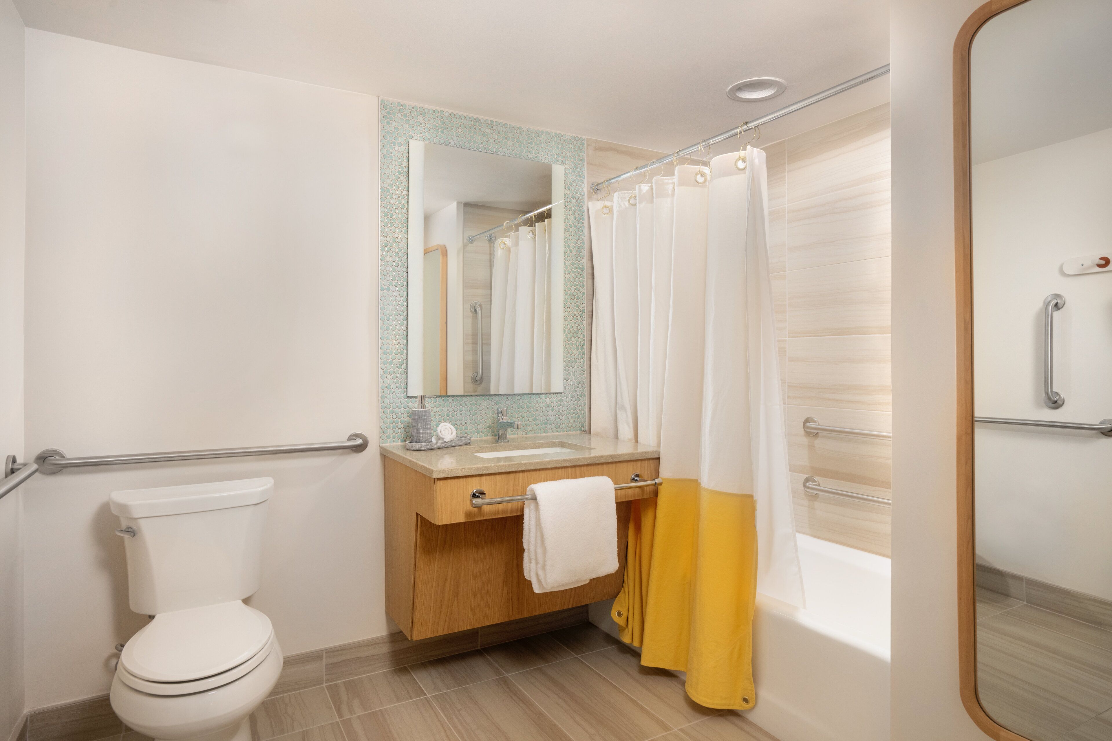 combined shower/bathtub, designer toiletries, hair dryer, bathrobes