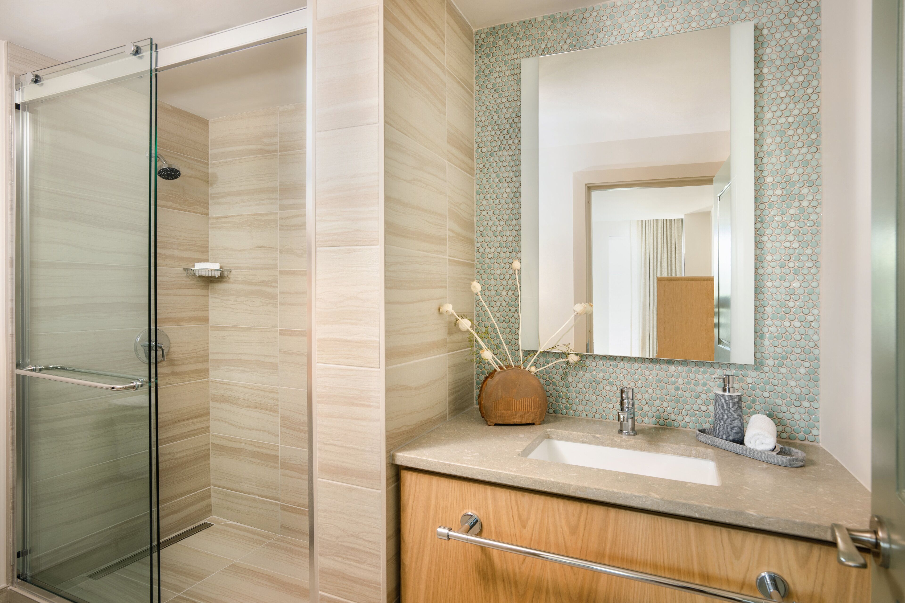 combined shower/bathtub, designer toiletries, hair dryer, bathrobes