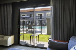 Room, 1 King Bed with Sofa bed, Non Smoking, Pool View (Patio) | Living room | 26-inch LCD TV with cable channels, TV, pay movies