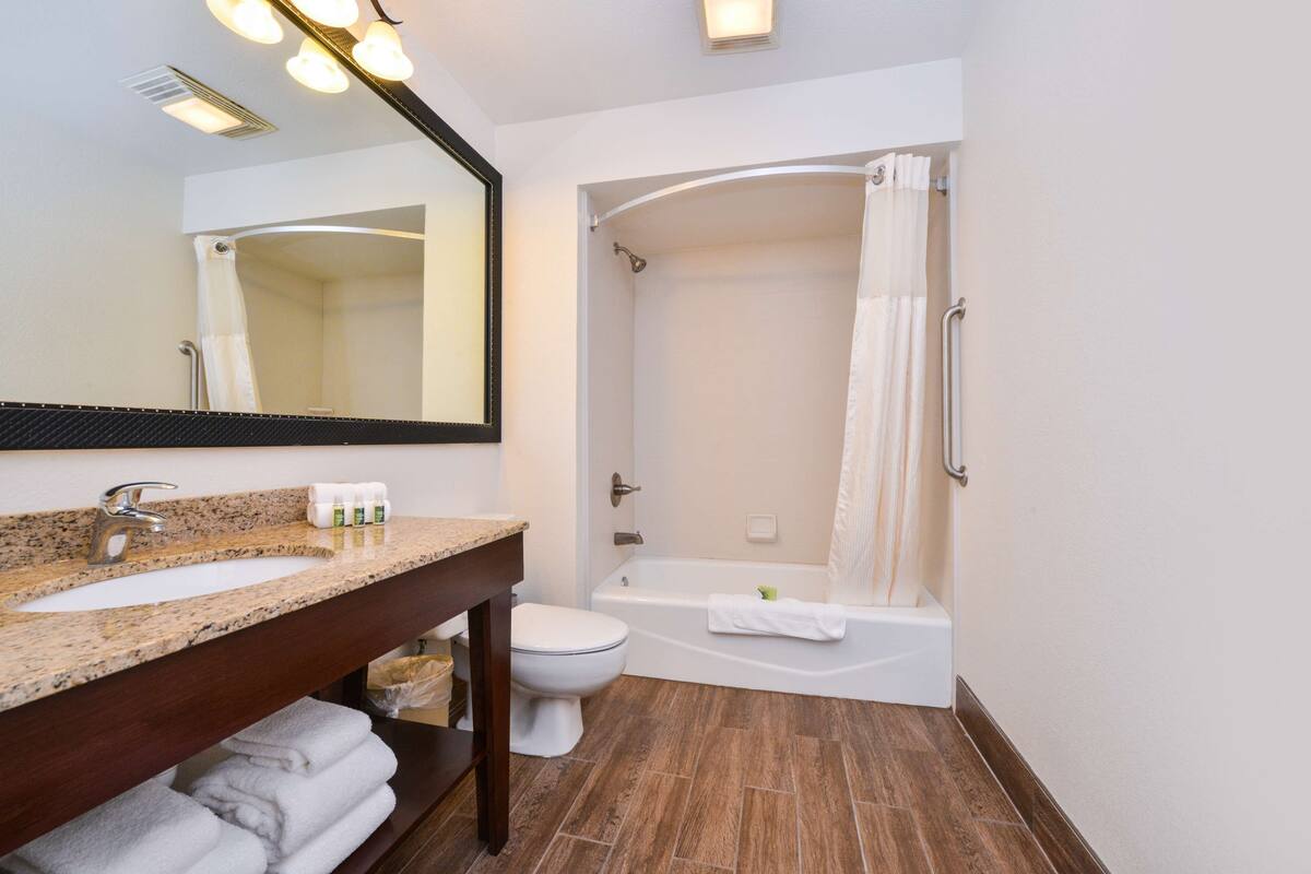 suite, multiple beds, non smoking, refrigerator & microwave | bathroom | rainfall showerhead, free toiletries, hair dryer, towels