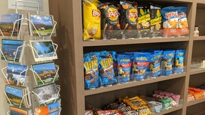 A snack display with various brands like Doritos, Lay's, Planters, and more. - Holiday Inn Express South Burlington by IHG (South Burlington)