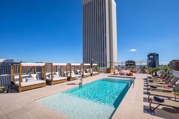 Seasonal outdoor pool, pool loungers