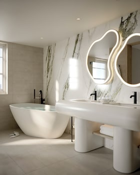 Ocean View King Suite | Bathroom | Combined shower/tub, rainfall showerhead, designer toiletries at Delano Miami Beach