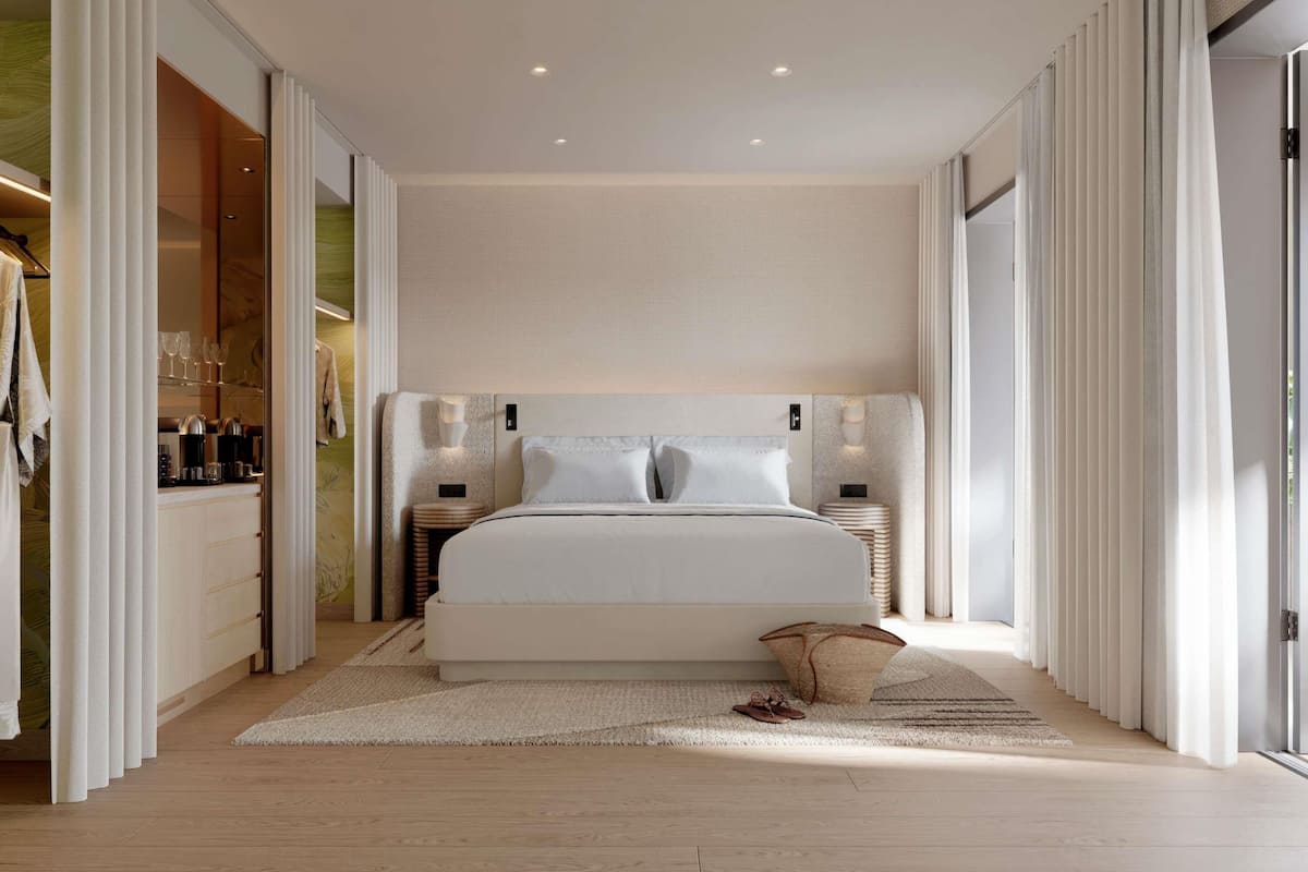 Une chambre moderne avec un grand lit, des tables de chevet, une armoire et une vue par la fenĂȘtre.