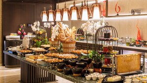 A buffet with various food items and beverages, including pastries, fruits, and a variety of drinks. - Divan Istanbul (Istanbul)