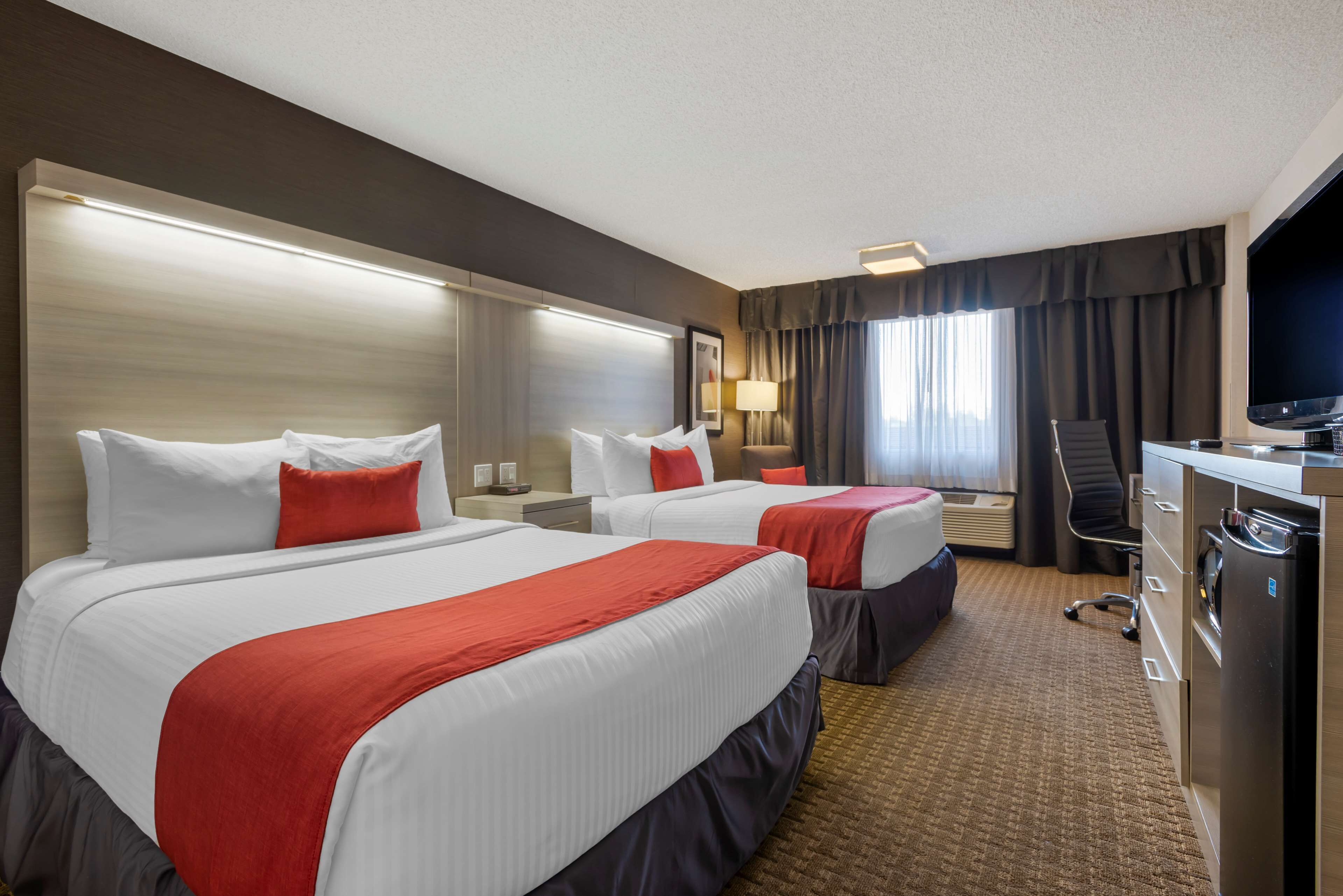 standard room, 2 queen beds, non smoking, refrigerator & microwave | 1 bedroom, premium bedding, pillow-top beds, in-room safe