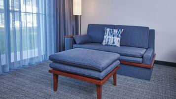 Desk, laptop workspace, blackout drapes, iron/ironing board