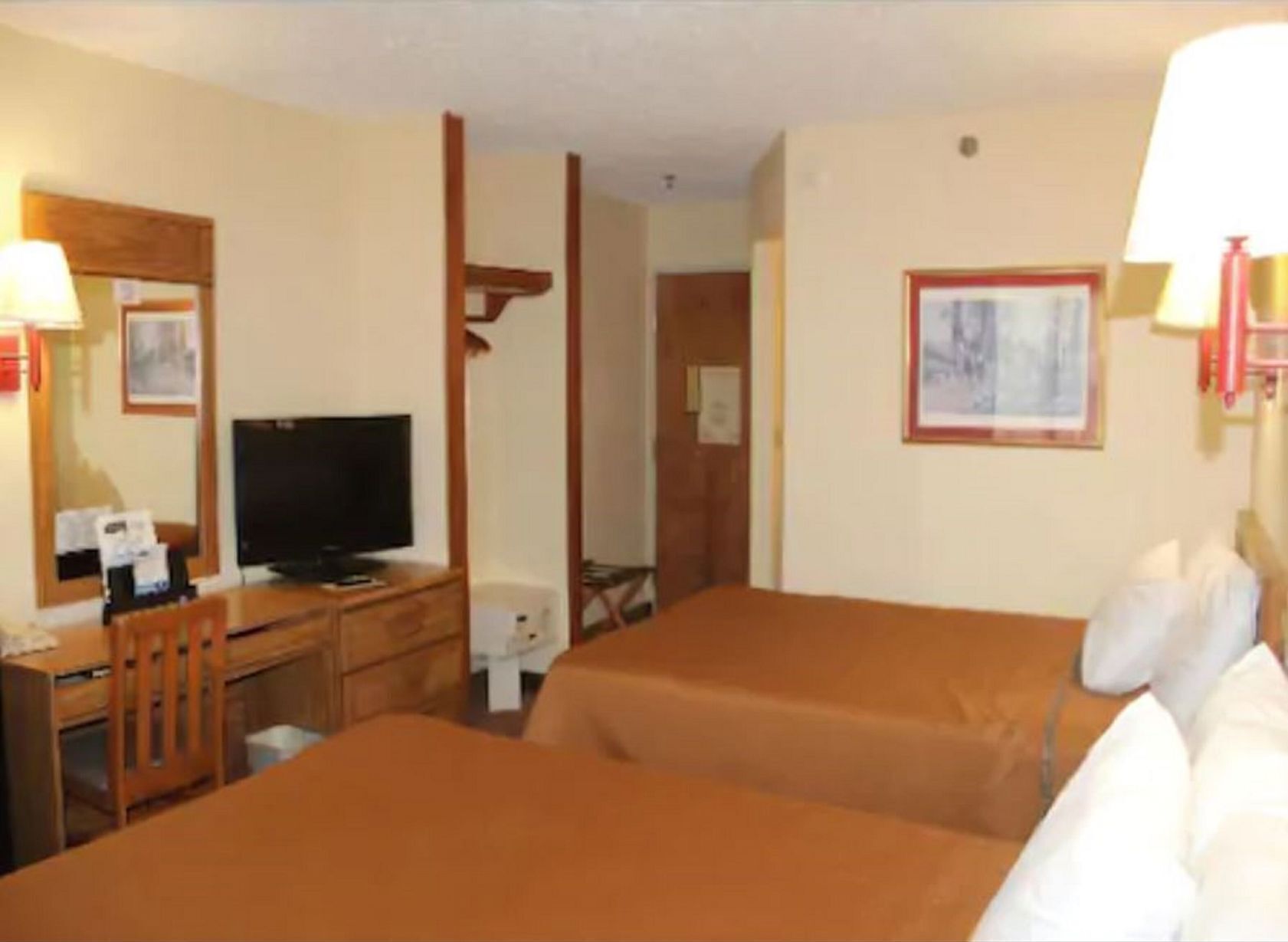 Premium bedding, desk, laptop workspace, soundproofing