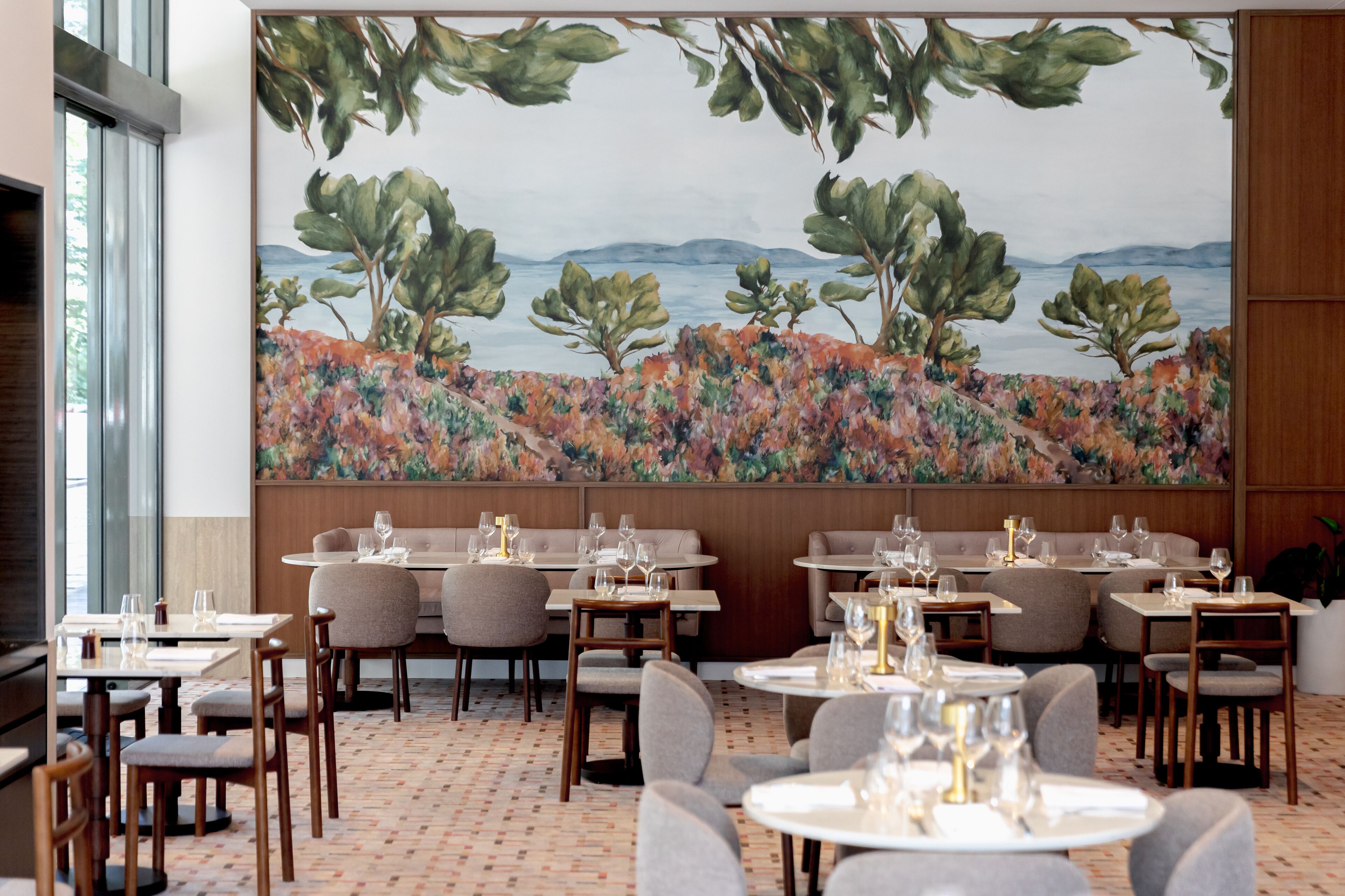 A restaurant with tables and chairs arranged for dining.