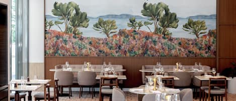 A restaurant with tables and chairs arranged for dining.