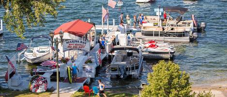 A marina with boats docked, a boat rental service, and a small dockside restaurant.