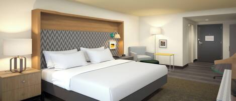A hotel room with a large bed, bedside tables, a chair, a desk, and a door.