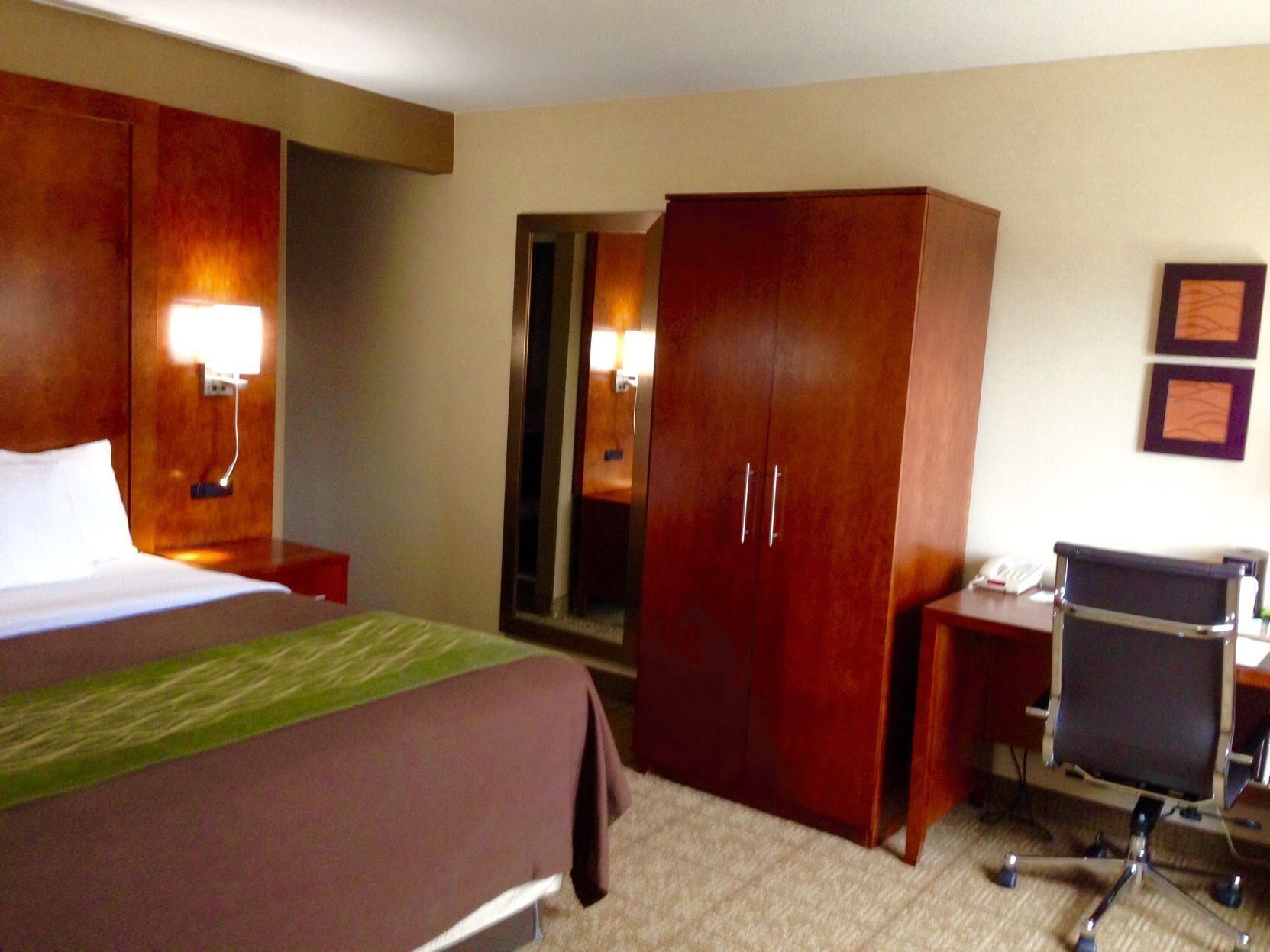 Desk, laptop workspace, blackout drapes, iron/ironing board