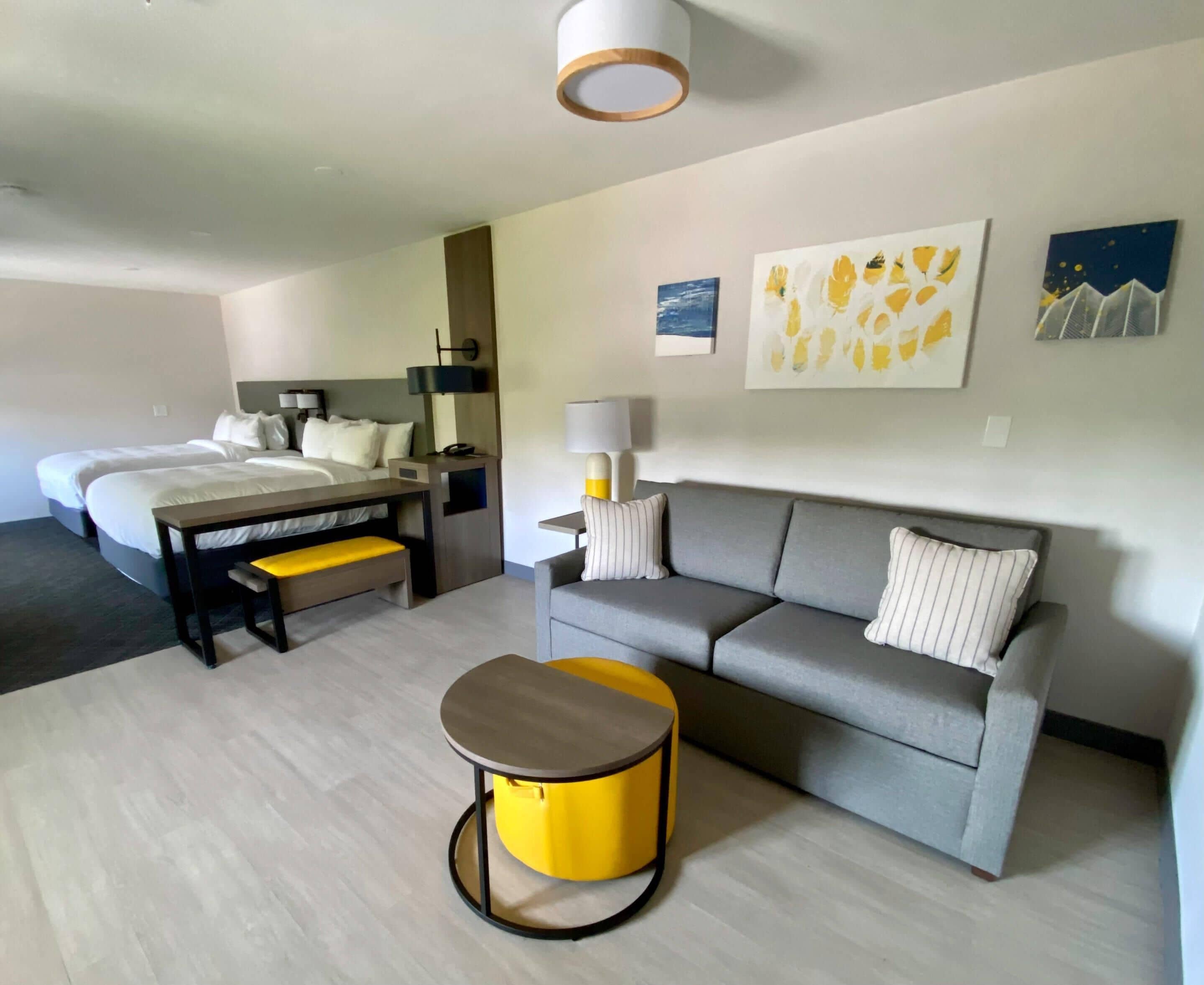 Suite, Multiple Beds, Non Smoking | Desk, laptop workspace, blackout drapes, iron/ironing board