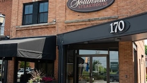 A brick building with a sign reading 'Southside Steakhouse' and the number '170' above the entrance.