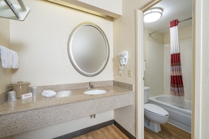 Combined shower/tub, towels, soap, shampoo