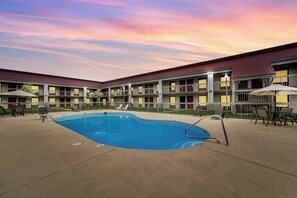 Seasonal outdoor pool, open 10:00 AM to 10:00 PM, pool umbrellas