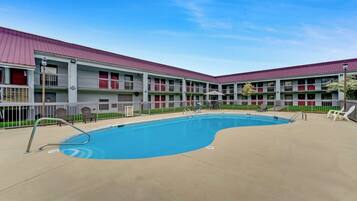 Seasonal outdoor pool, open 10:00 AM to 10:00 PM, pool umbrellas