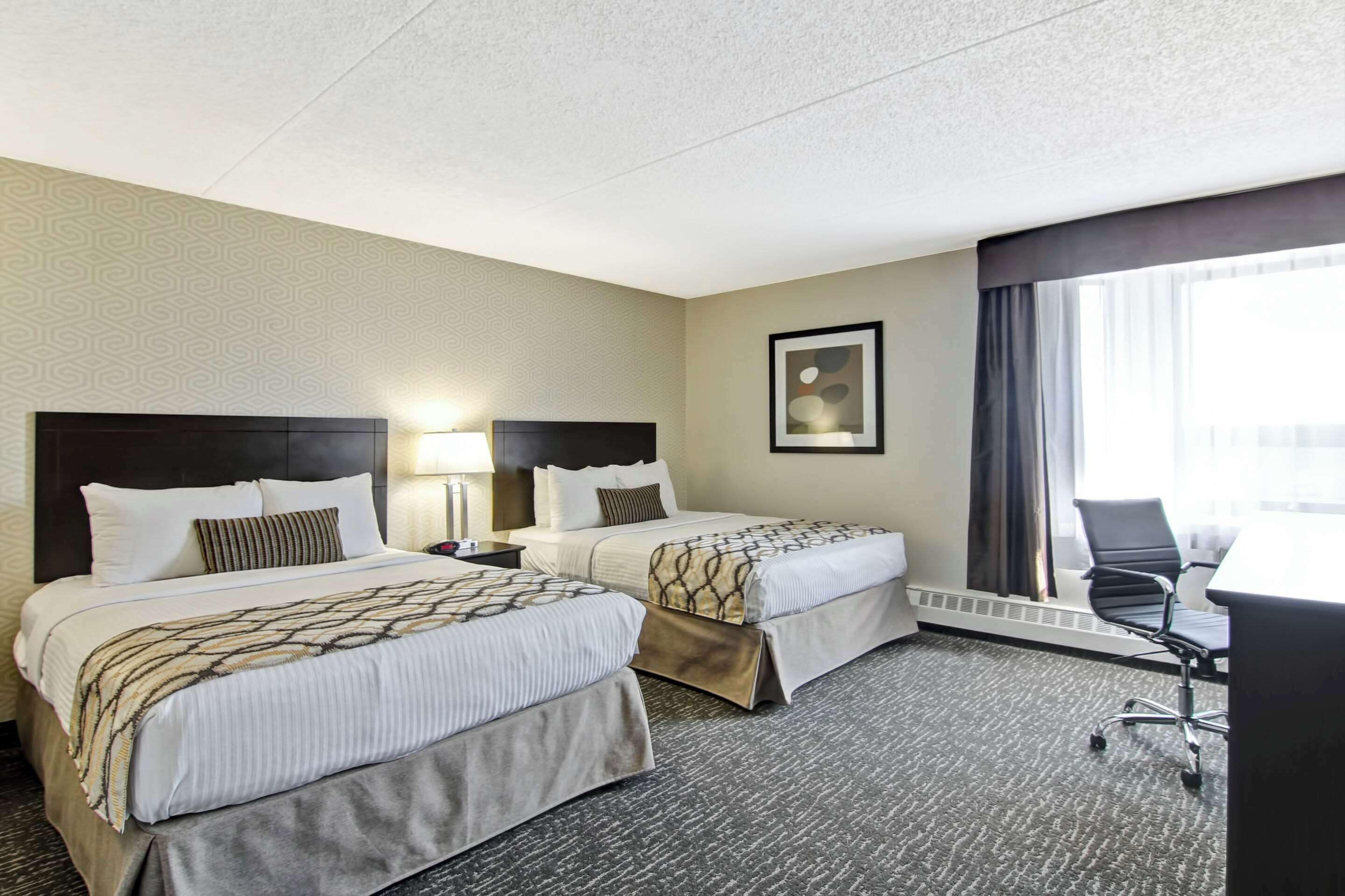 Premium bedding, Select Comfort beds, individually furnished, desk