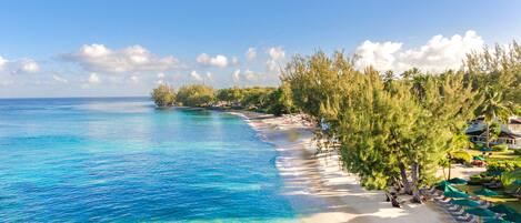 On the beach, white sand, sun loungers, scuba diving