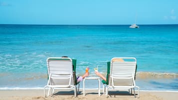 On the beach, white sand, sun loungers, scuba diving